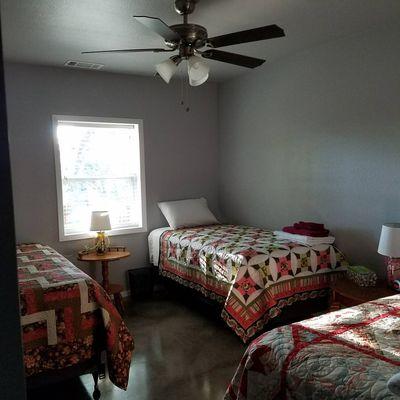 Retreat House has 5 bedrooms with 3 beds and a bath in each.