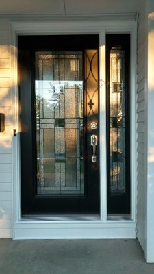 A front entry door with sidelight adds beauty to any home