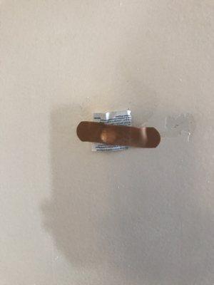 They really put a BAND AID to cover the peep hole. Just gross!