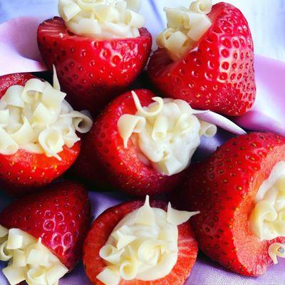 Cheesecake Stuffed Strawberries topped with White Chocolate Curls.