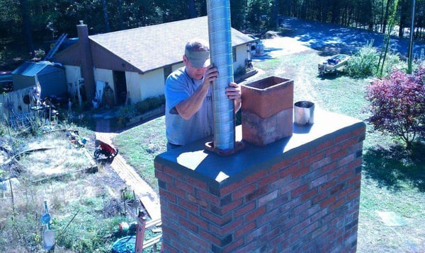 John Butler installing a liner.