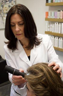 During a hair and scalp evaluation appointment, I use a scope to look at your hair follicles and scalp condition.