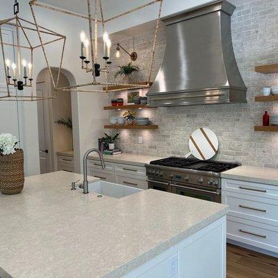 Custom metal hood in this renovated kitchen