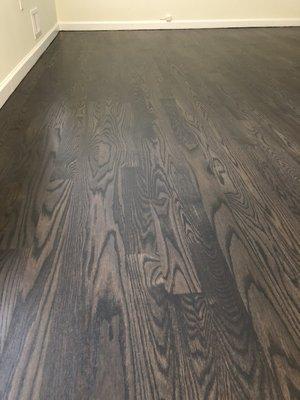 Refinished floor stained Graphite & grey mixture.