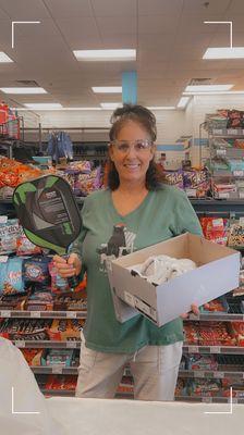 Julie A holding my me adidas court shoes, cool green pickle ball paddle and I love my new sport bras, shorts & goggles.