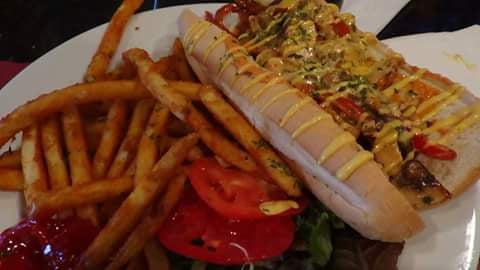 Chicken Cheesrsteak, fries, and vegetables on menu.