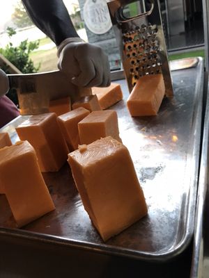 Fresh blocks of cheese prepping for the Ultimate 5 Cheese MAC!