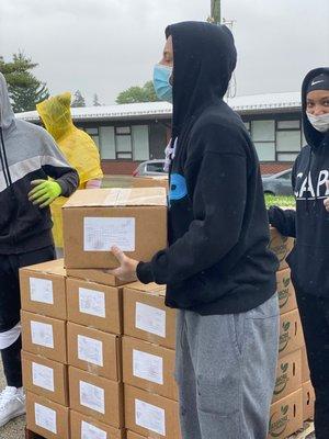 Church volunteers distributing boxes at our Community Food Bank.