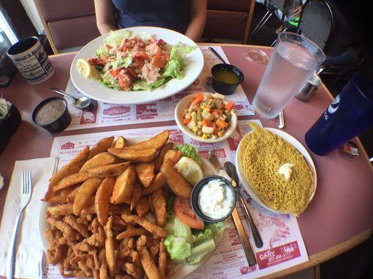 Mom's Lobster salad and my fried clam strips with jojo potatoes, veg and ployes