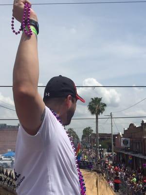 RJ has become a whiz at throwing beads