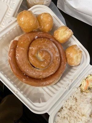 Donut holes and a cinnamon roll.