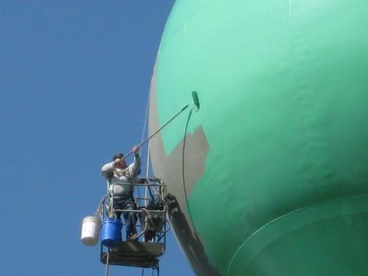 TMI painting a water tank