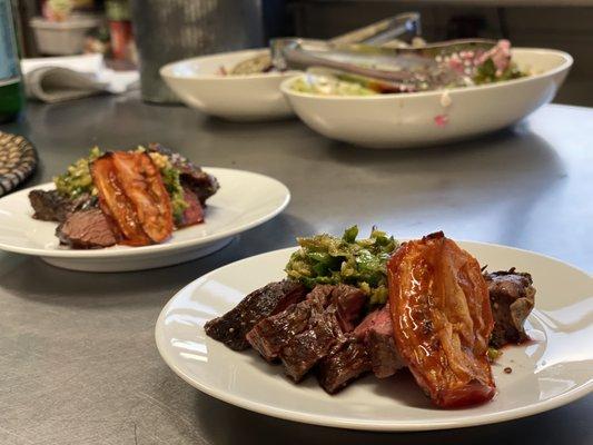 Grilled skirt steak with burnt shishito pepper salsa verde, roasted tomatoes, pickled mustard seeds