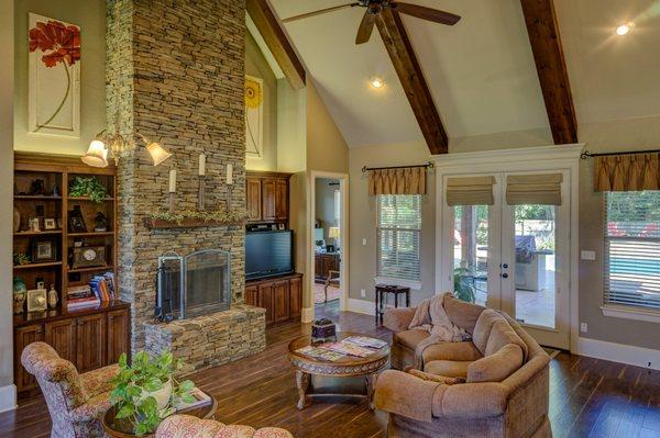 A natural stacked stone fireplace project we completed. Acts as a perfect focal point for this vaulted ceiling living room.