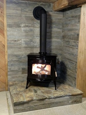 Great American Fireplace install, Blaze King Ashford cast iron wood stove in Chestnut enamel finish with  flag stone hearth, Boardwalk tile