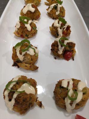 Mini crab cakes in a remoulade sauce