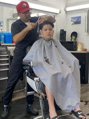 My kid getting his hair cut