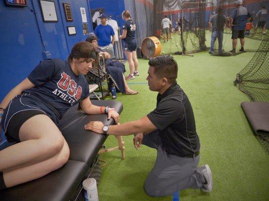 Dr. EROD assessing a softball client.