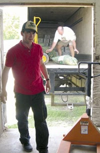 The Sides' grandson, Brandon, workin' on the Pea Farm.  It's a family tradition!