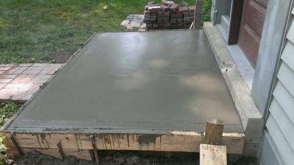 Customer wanted an old brick pad ripped out....and we went over it with concrete....