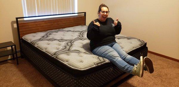 A very happy customer on her new bed!