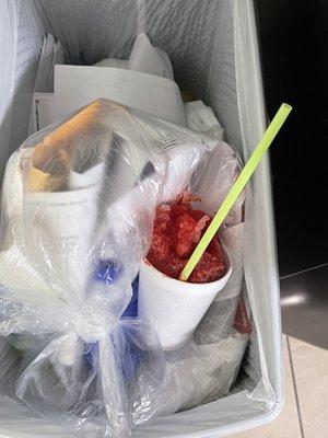 Snow cone in trash