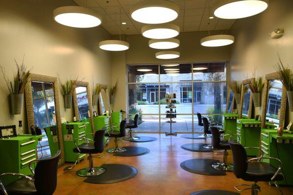 The chic, clean styling area and salon chairs at Breeze Salon and Day Spa, the best salon and spa in Cedar Park, featuring Aveda.