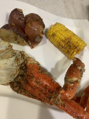 Snow crab legs, potatoes and corn on the cob