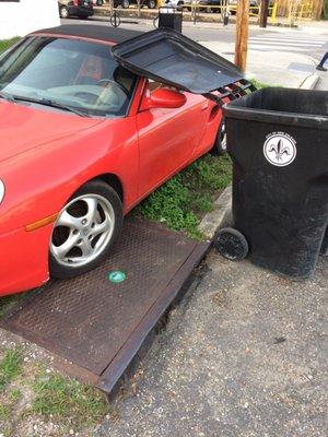 Garbage man left lid open on my Porsche