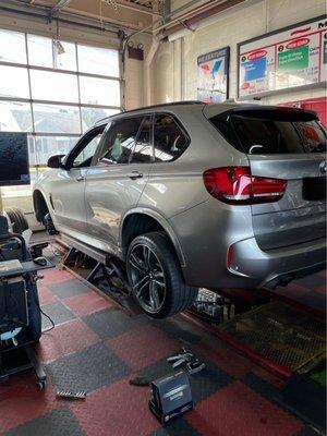 Car on lift for state inspection