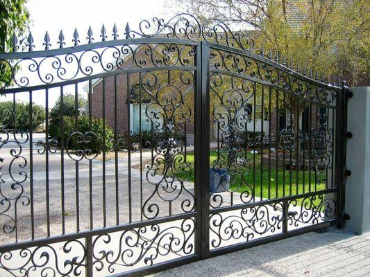 Custom iron design drive way gate