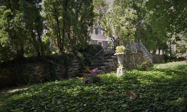 Shirley Place's parterre garden offers a quiet, shady spot for reflection.