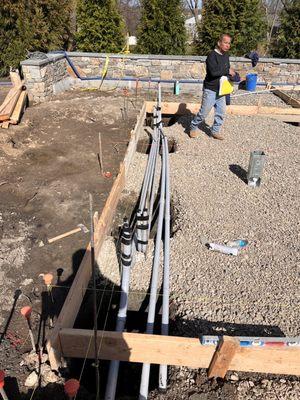 Installation of electrical conduit in concrete slab for pergola .        New Canaan