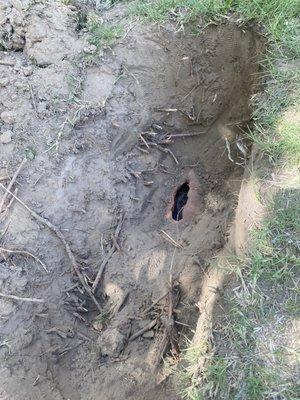 This is the hole he dug and the pipe he broke to get his tool unstuck. That took two hours. He could have at least covered the hole back up