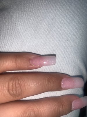 Visibly crooked, lumpy, uneven, missed spots of gel polish and you can see on my pinky he didn't even bring the acrylic all the way up