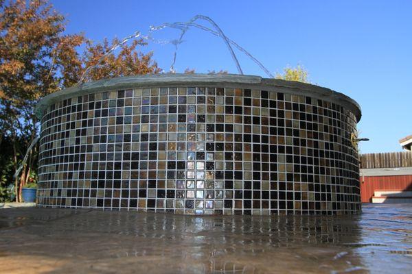 Firepit with BMX100 tile and water features