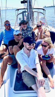 Friends sailing together - Baltimore's best group outing on a private sailing charter!