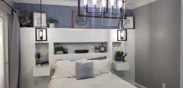 Headboard wall, marble niche, floating nightstand and built in outlets