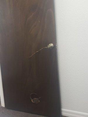 A door broken by an employee after being called ghetto by the owner and shoved with the door by the owner