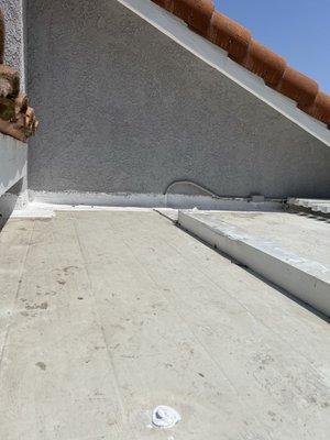 Resealing the top of the patio deck.