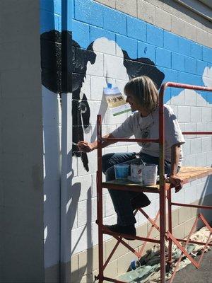 Painting the giant cow face mural in Yreka 2018.