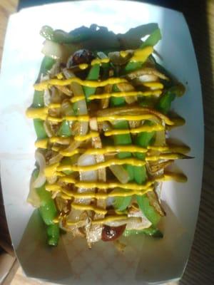 Game day Honker Dog! Sausage, grilled onion/green peppers, shoestring potatoes and mustard.