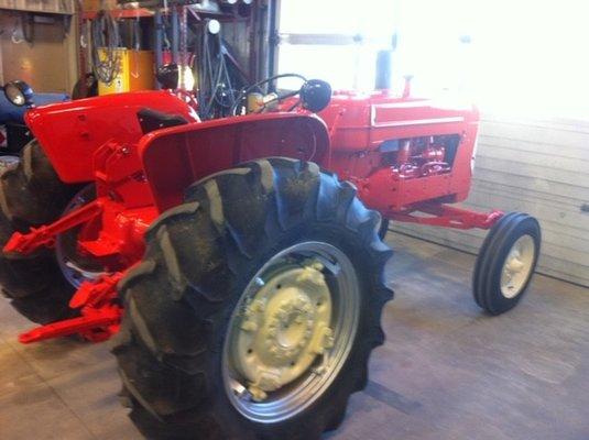 A tractor all freshly painted at our paint house