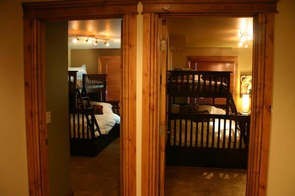 The two side-by-side bunk rooms. Each has a twin-over-full bunk bed, with a pull-out twin trundle bed underneath.