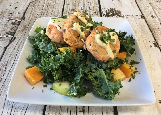 Salmon Cakes over Kale Salad with Pumpkin, Apples, Raisins and Balsamic Vinaigrette