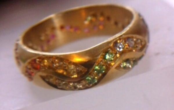 My custom anniversary band with heirloom gold. A stunning rainbow of color.