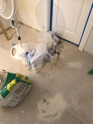 Unprofessional - this is how 'Your Handyman' left the walls and master bedroom floor after the work was 'completed'.