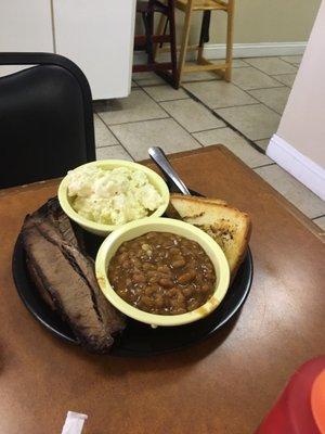 Brisket with homemade potato salad and beans.