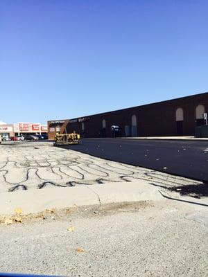 Before photo of commercial Plaza being prepped for complete resurface of parking lot