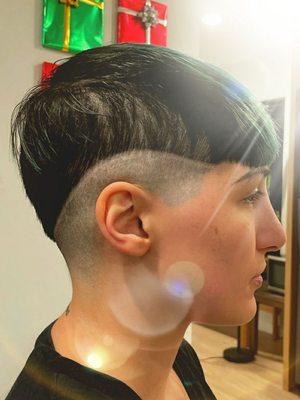 Slick low-taper fade on disconnected undercut with tramline. Man's an artist.